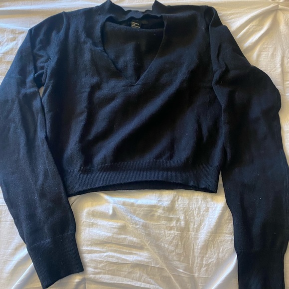 This is a black knit crop top with a key hole front. - Picture 1 of 3